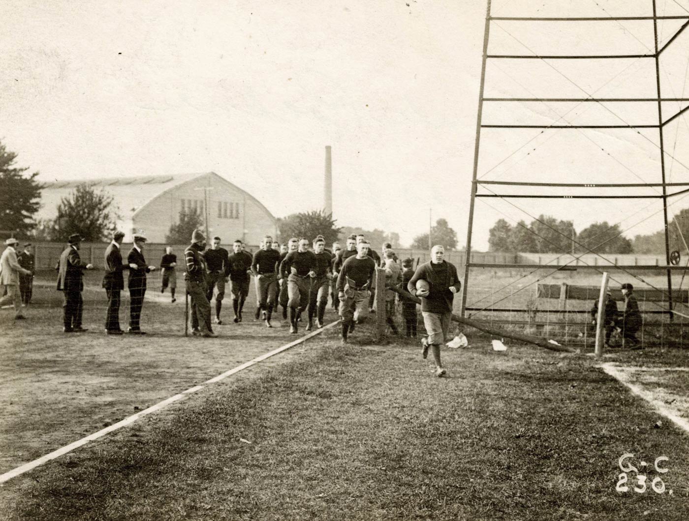 1913 team captain Knute Rockne leading the Notre Dame team onto the field 1913 team captain Knute Rockne leading the Notre Dame team onto the field