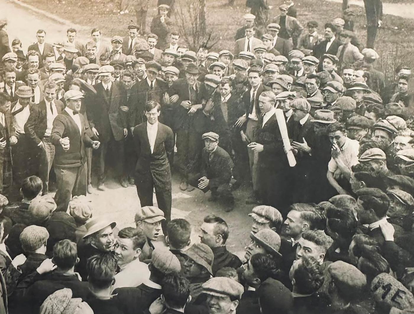 Rockne on campus with a group of students Rockne on campus with a group of students