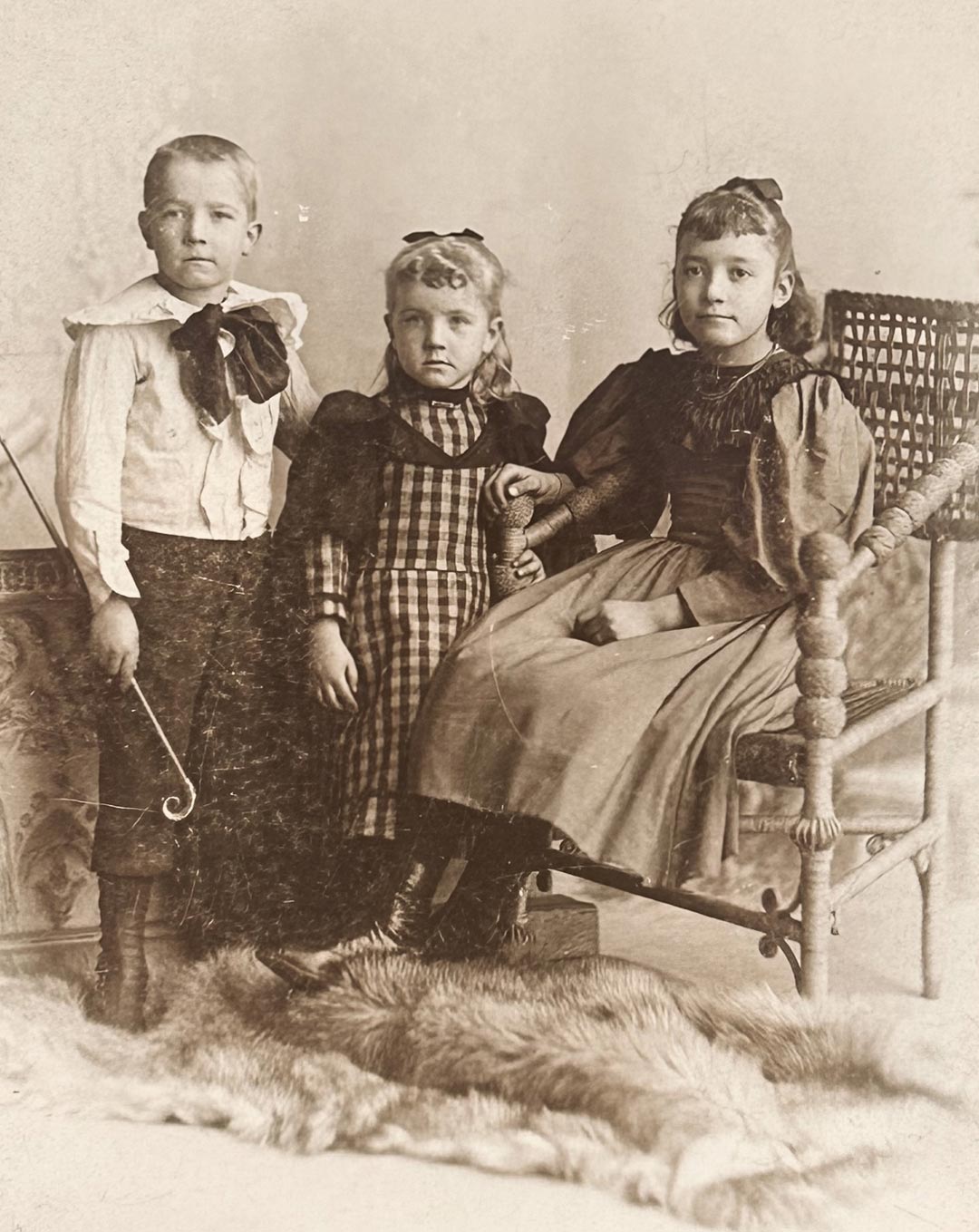 A photograph of young Knute Rockne taken with two sisters A photograph of young Knute Rockne taken with two sisters