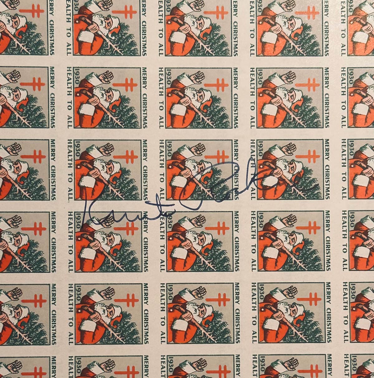 Christmas Seals with Rockne's signature An image of the sheet of Christmas Seals with Rockne's signature on top