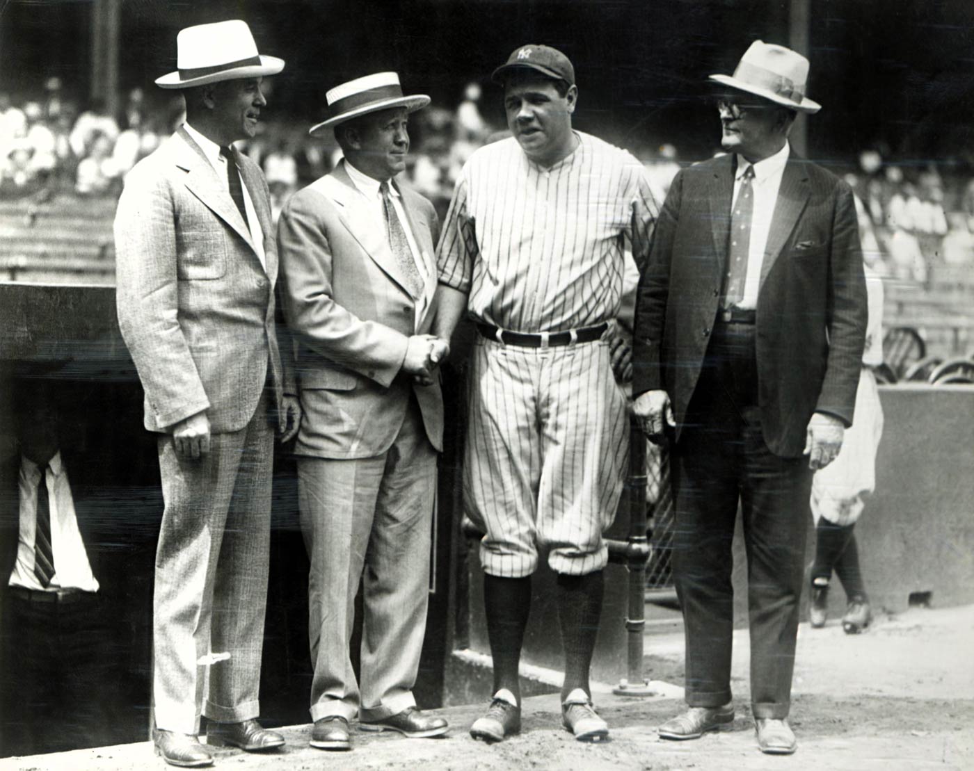 Knute Rockne and Babe Ruth A black and white photo of Rockne and Ruth shaking hands in Yankee Stadium